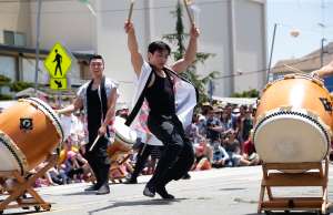 Anyone can join the hundreds of costumed, paper fan–wielding dancers who crowd <...